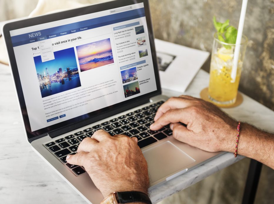 Elderly man is using computer laptop